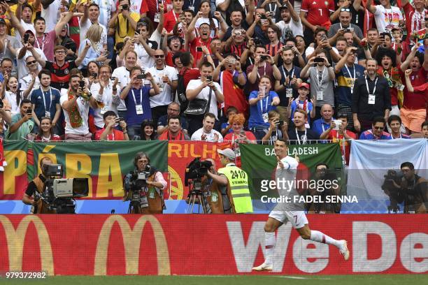 Portugal's forward Cristiano Ronaldo celebrates after scoring a goal during the Russia 2018 World Cup Group B football match between Portugal and...