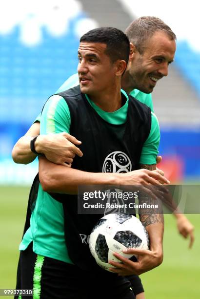 Tim Cahill and Matthew Jurman of Australia take part during an Australia Socceroos training session ahead of the 2018 FIFA World Cup match against...