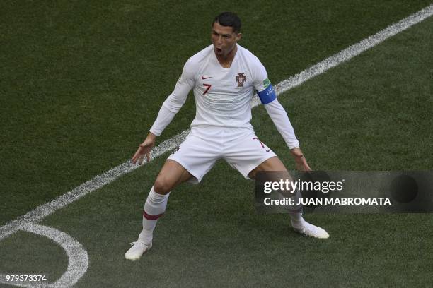 Portugal's forward Cristiano Ronaldo celebrates his opening goal for Portugal during the Russia 2018 World Cup Group B football match between...