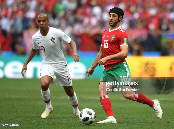 Joao Mario of Portugal battles for possession with Noureddine Amrabat of Morocco l during the 2018 FIFA World Cup Russia group B match between...