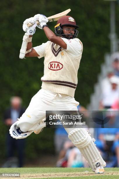 Arun Harinath of Surrey hits a boundary during day 1 of the Specsavers County Championship Division One match between Surrey and Somerset on June 20,...