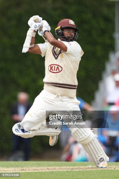 Arun Harinath of Surrey hits a boundary during day 1 of the Specsavers County Championship Division One match between Surrey and Somerset on June 20,...