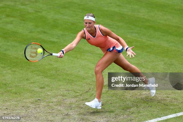 Kristina Mladenovic of France reaches for a forehand during her Round of 16 match against Magdalena Rybarikova of Slovakia during Day Five of the...