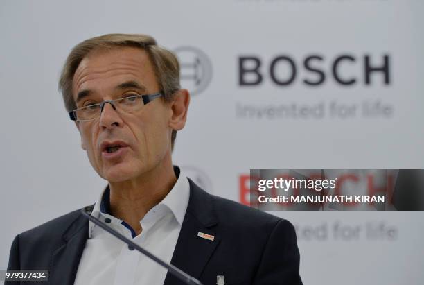 Dr Volkmar Denner, chairman of the board of management of Robert Bosch GmbH addresses a press conference at the Bosch facility in Bangalore on June...