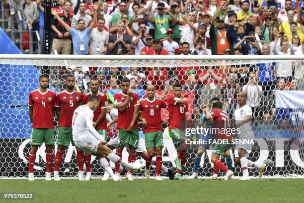 Portugal's forward Cristiano Ronaldo shoots a free kick during the Russia 2018 World Cup Group B football match between Portugal and Morocco at the...
