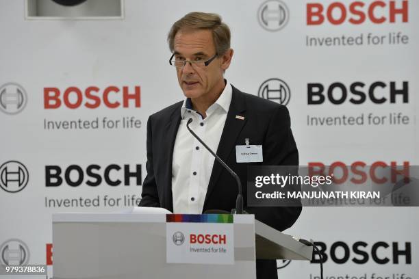 Dr Volkmar Denner, chairman of the board of management of Robert Bosch GmbH addresses a press conference at the Bosch facility in Bangalore on June...