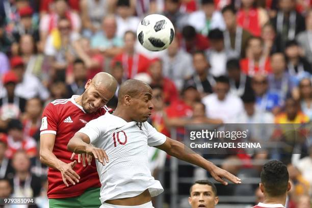 Morocco's midfielder Karim El Ahmadi vies for the ball with Portugal's midfielder Joao Mario during the Russia 2018 World Cup Group B football match...