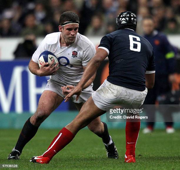 Joe Worsley of England is challenged by Thierry Dusautoir of France during the RBS Six Nations Championship match between France and England at the...