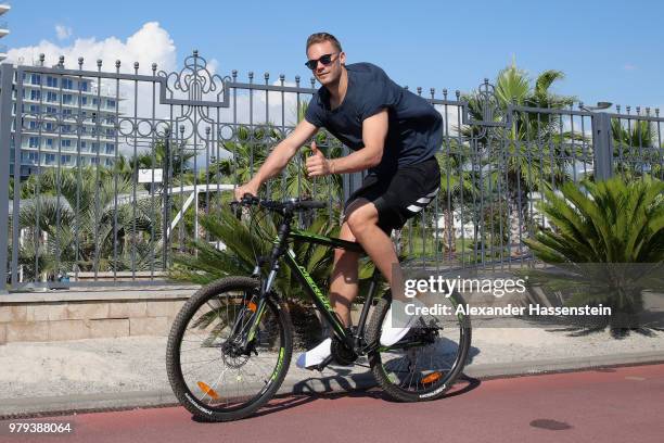 Manuel Neuer of Germany rides a bike outside the team hotel Radisson Blu Paradise Resort & Spa at Adler Beach Boulevard during the 2018 FIFA World...