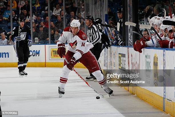 Taylor Pyatt of the Phoenix Coyotes passes the puck against the Tampa Bay Lightning at the St. Pete Times Forum on March 16, 2010 in Tampa, Florida.