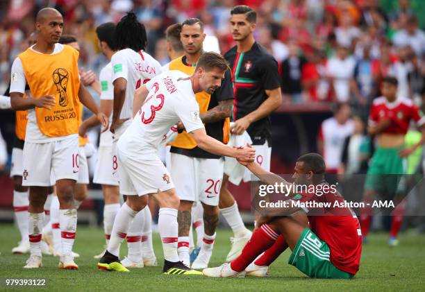 Adrien Silva of Portugal consoles Ayoub El Kaabi of Morocco at the end of the 2018 FIFA World Cup Russia group B match between Portugal and Morocco...