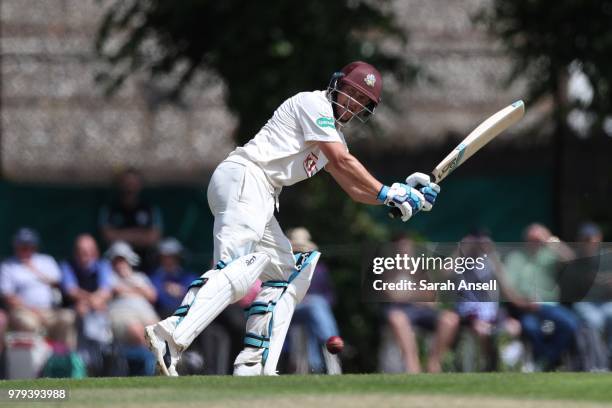 Scott Borthwick of Surrey hits a boundary during day 1 of the Specsavers County Championship Division One match between Surrey and Somerset on June...