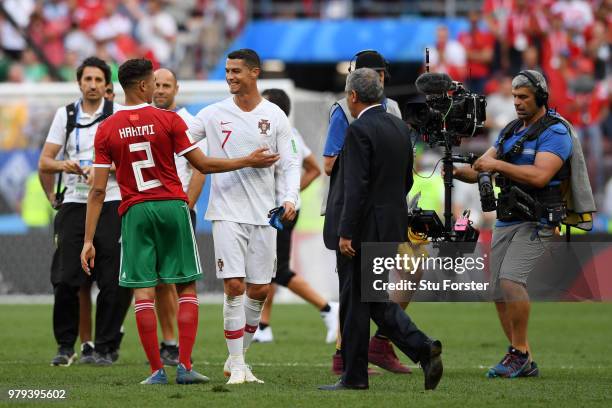 Cristiano Ronaldo of Portugal consoles Achraf Hakimi of Morocco following Morocco's elimination from the World Cup after their defeat in the 2018...