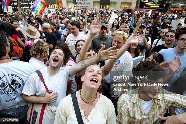 Protesters chant the name of political commentator Bill O'Reilly during a demonstration outside the Fox News building on Sixth Ave.