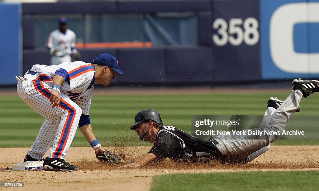 Colorado Rockies' Cory Sullivan tries to steal second and is