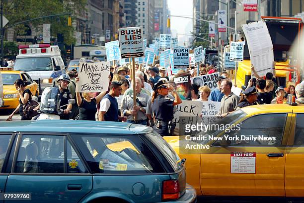 Protesters march up Sixth Ave. As President George Bush addresses the General Assembly at the United Nations. The march ended at Dag Hammarskjold...