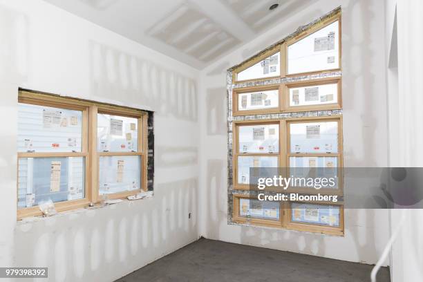 Hurricane-rated windows are seen during construction of a home designed to withstand extreme weather in the Breezy Point neighborhood of the Queens...