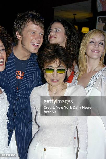 Yoko Ono, John Lennon's widow, is surrounded by cast members of the new Broadway musical "Lennon" during an after-party at Sardi's on W. 44th St....