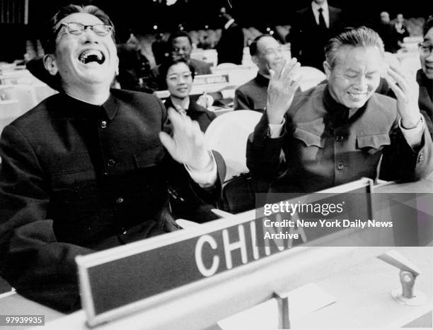 China's Foreign Minister Chiae Kuan-Hua and China's U.N. Representative Huang Hua laugh as they take their seats at the United Nations General...