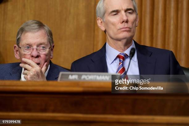 Senate Finance Committee members Sen. Johnny Isakson and Sen. Rob Portman listen to U.S. Secretary of Commerce Wilbur Ross testifiy before the...