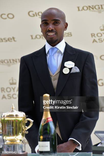 Sir Mo Farah presents The Queen Mary Stakes trophy on day 2 of Royal Ascot at Ascot Racecourse on June 20, 2018 in Ascot, England.