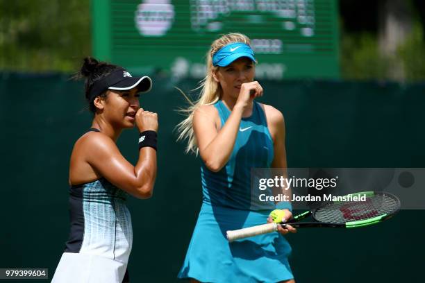 Heather Watson and Katie Boulter of Great Britain talk during their Round of 16 match against Lyudmyla Kichenok of the Ukraine and Alla Kudryavtseva...