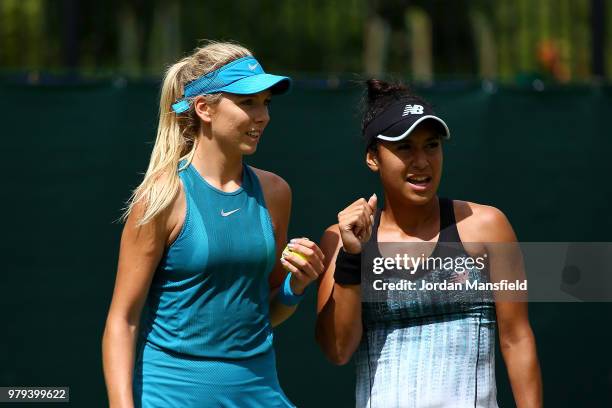 Heather Watson and Katie Boulter of Great Britain talk during their Round of 16 match against Lyudmyla Kichenok of the Ukraine and Alla Kudryavtseva...