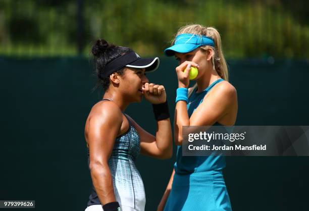 Heather Watson and Katie Boulter of Great Britain talk during their Round of 16 match against Lyudmyla Kichenok of the Ukraine and Alla Kudryavtseva...