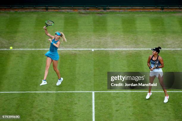 Heather Watson and Katie Boulter of Great Britain in action during their Lyudmyla Kichenok of the Ukraine and Alla Kudryavtseva of Russia during Day...