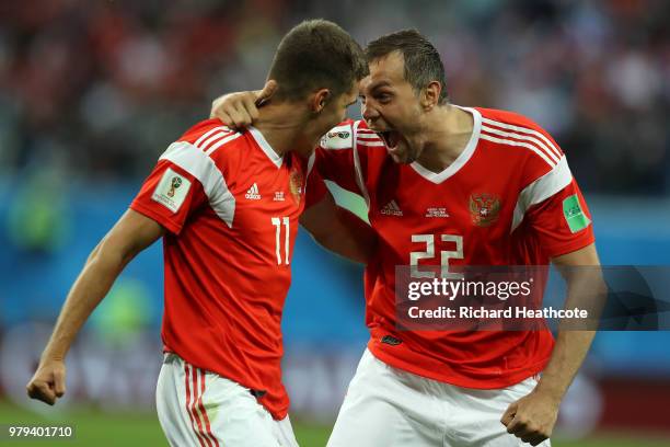 Artem Dzyuba and Roman Zobnin of Russia celebrate the first Russia goal, an own goal by Ahmed Fathi of Egypt, during the 2018 FIFA World Cup Russia...