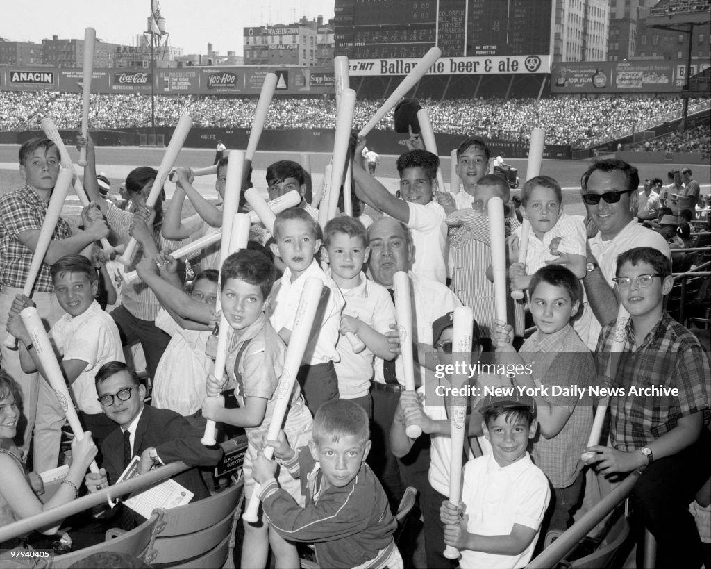 Youngsters holdup bats, compliments of the Yankee management