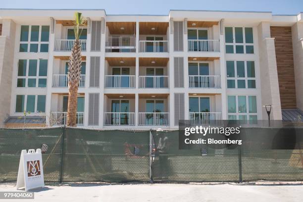 Fencing during construction of the 121 Marina residential condominium complex designed to withstand extreme weather at Ocean Reef Club in Key Largo,...