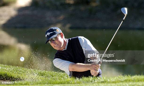 Justin Leonard blasts from a sand trap during final round competition February 1, 2004 at the 2004 FBR Open at the Tournament Players Club at...