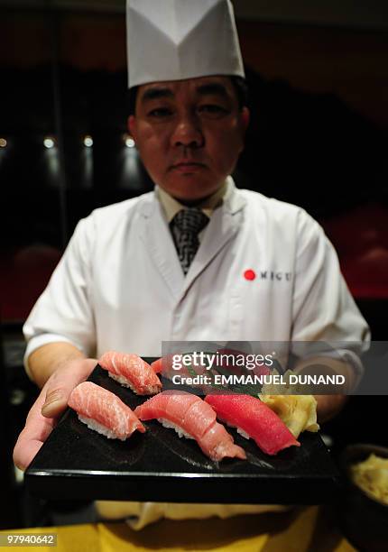 Sushi chef William Tawng displays a sushi selection made from a bluefin tuna at the upscale New York Japanese restaurant Megu in New York, March 10,...