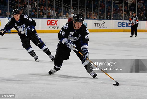 Martin St. Louis of the Tampa Bay Lightning prepares to shoot the puck against the Phoenix Coyotes at the St. Pete Times Forum on March 16, 2010 in...