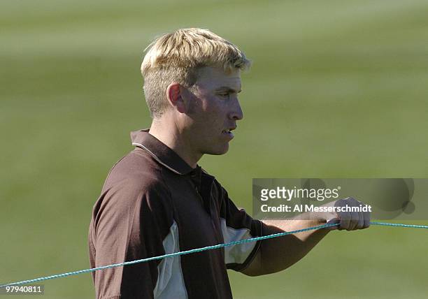 Ricky Barnes moves a rope during final round competition February 1, 2004 at the 2004 FBR Open at the Tournament Players Club at Scottsdale, Arizona.