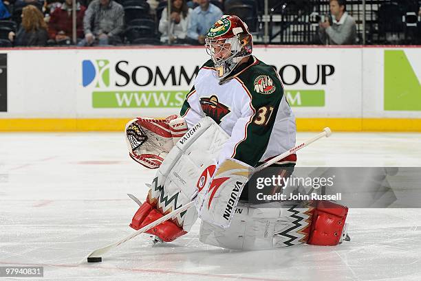 Josh Harding of the Minnesota Wild plays the puck against the Nashville Predators on March 18, 2010 at the Bridgestone Arena in Nashville, Tennessee.