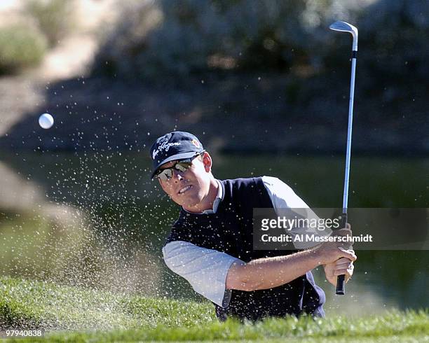 Justin Leonard blasts from a sand trap during final round competition February 1, 2004 at the 2004 FBR Open at the Tournament Players Club at...