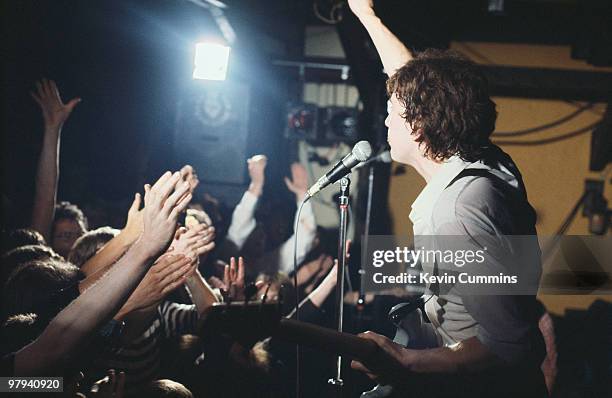 Singer and bassist Tom Robinson of the Tom Robinson Band performs on stage at Rafters in Manchester, England circa 1978.