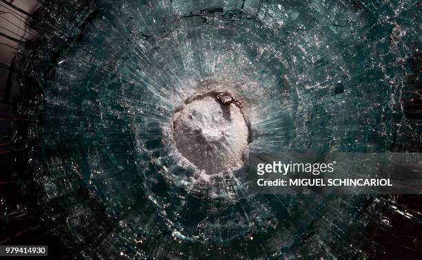 Detail after a shooting test with a .357 Magnum in an armoured car in Maua, Sao Paulo, Brazil on December 15, 2017. - The city of Sao Paulo leads the...