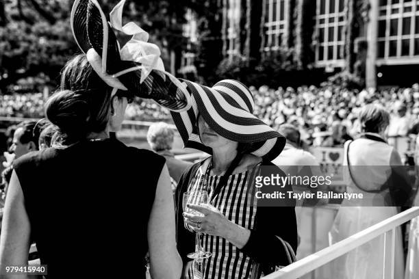 Belmont Stakes: Female fans wearing fancy hats before race at Belmont Park. Elmont, NY 6/9/2018 CREDIT: Taylor Ballantyne
