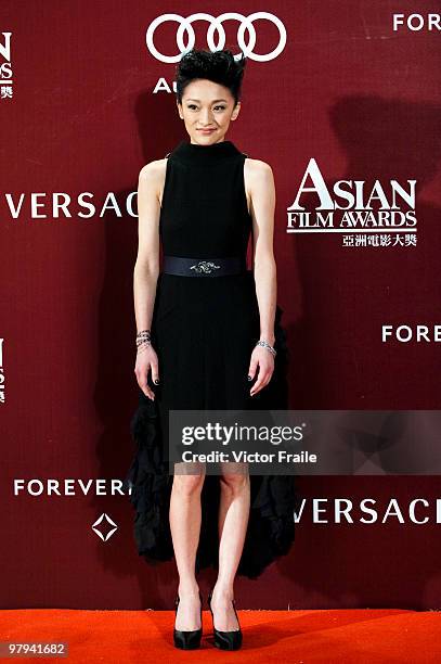 Chinese actress Zhou Xun poses on the red carpet for the 4th Asian Film Awards ceremony at the Convention and Exhibition Centre on March 22, 2010 in...