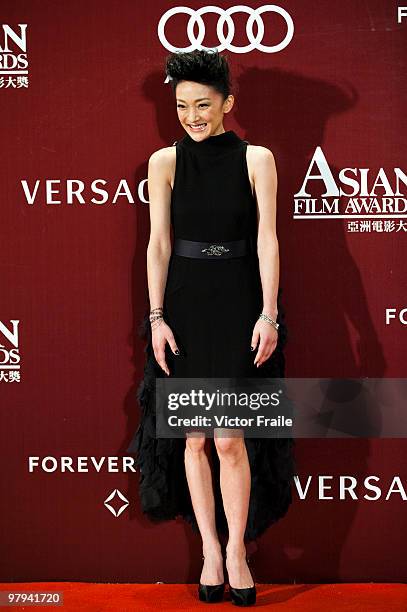 Chinese actress Zhou Xun poses on the red carpet for the 4th Asian Film Awards ceremony at the Convention and Exhibition Centre on March 22, 2010 in...