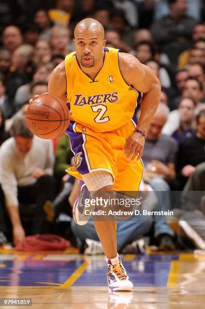 Derek Fisher of the Los Angeles Lakers drives the ball upcourt against the Charlotte Bobcats during the game on February 3, 2010 at Staples Center in...