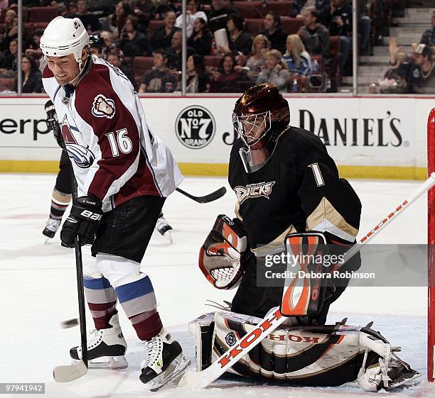 Jonas Hiller of the Anaheim Ducks defends against Darcy Tucker of the Colorado Avalanche during the game on March 21, 2010 at Honda Center in...