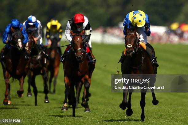 James Doyle celebrates as he rides Poet's Word to win The Prince of Wales Stakes as he beats Frankie Dettori on Cracksman on day 2 of Royal Ascot at...