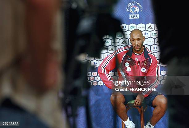 French forward Nicolas Anelka answers journalists' questions 13 November 2006 during a press conference in Senlis, outside Paris two days before...