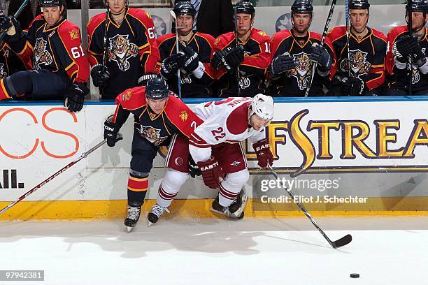 Keith Ballard of the Florida Panthers tangles with Lee Stempniak of the Phoenix Coyotes at the BankAtlantic Center on March 18, 2010 in Sunrise,...