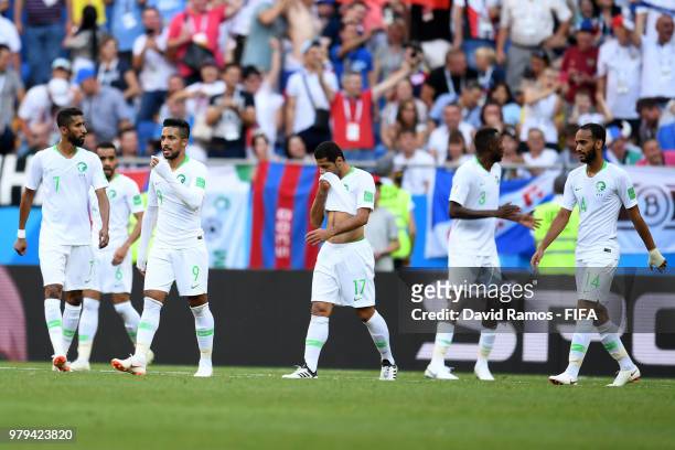 Saudi Arabia players look on dejected after conceding the first geoal to Uruguay during the 2018 FIFA World Cup Russia group A match between Uruguay...