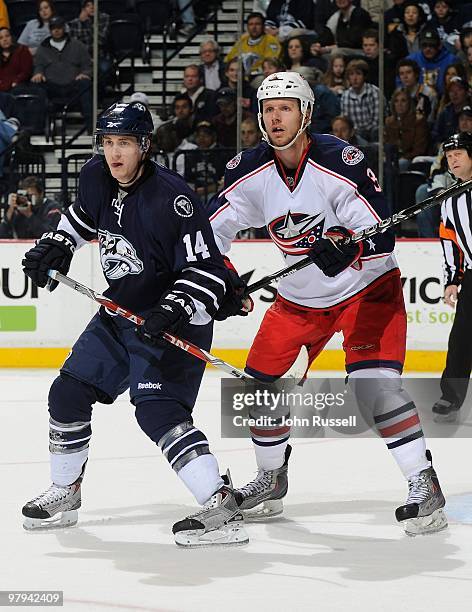 Dustin Boyd of the Nashville Predators skates against Marc Methot of the Columbus Blue Jackets on March 20, 2010 at the Bridgestone Arena in...